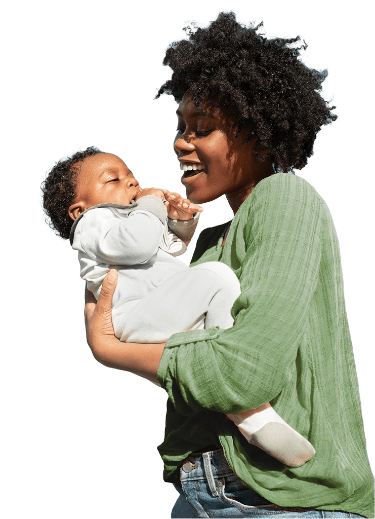 a woman holding her baby and smiling